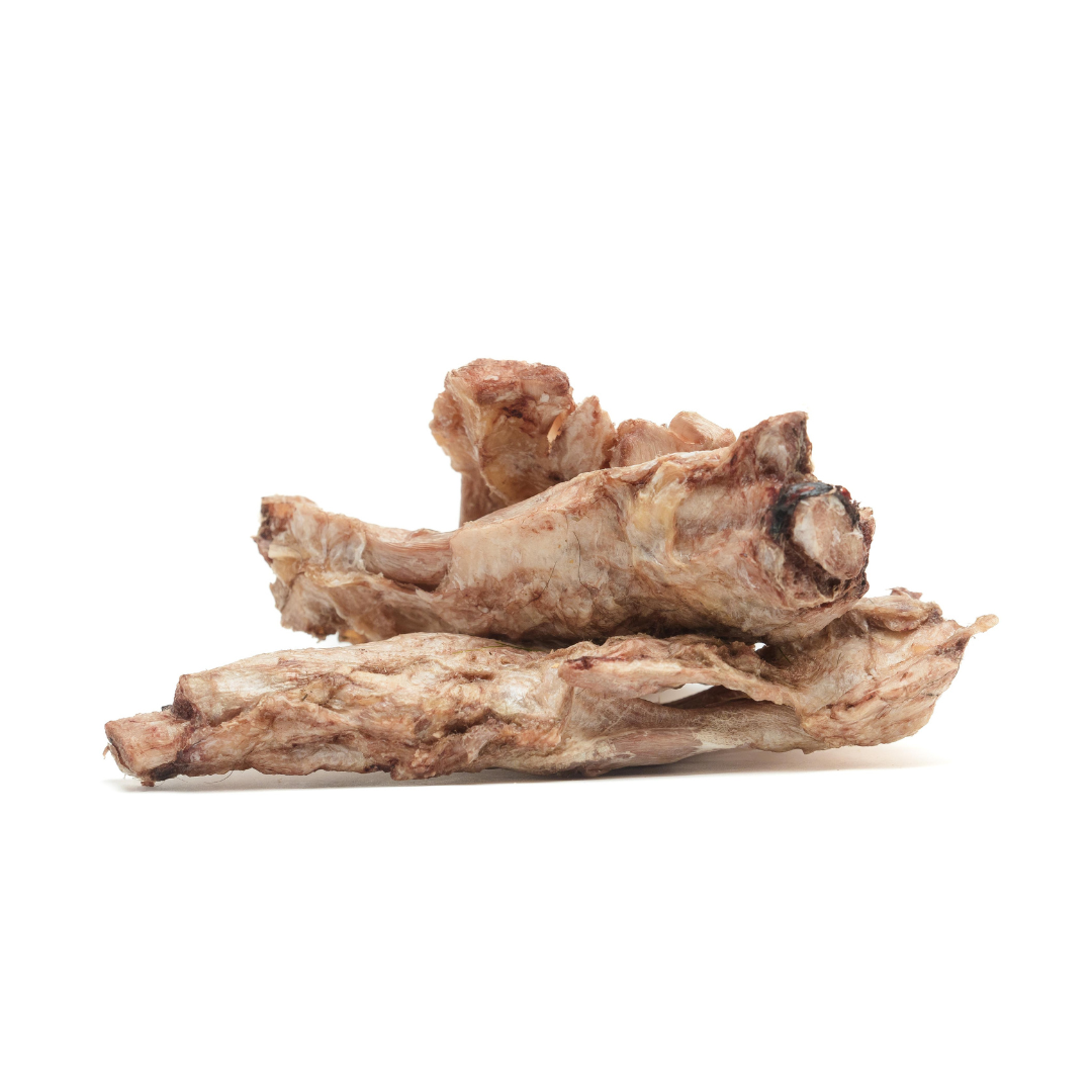 A pile of Beast Feast Freeze-Dried Bison Half Flexor Tendon on a white background.