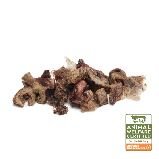Pile of Beast Feast Organic Freeze-Dried Turkey Hearts (cubed) 3oz on a white background.