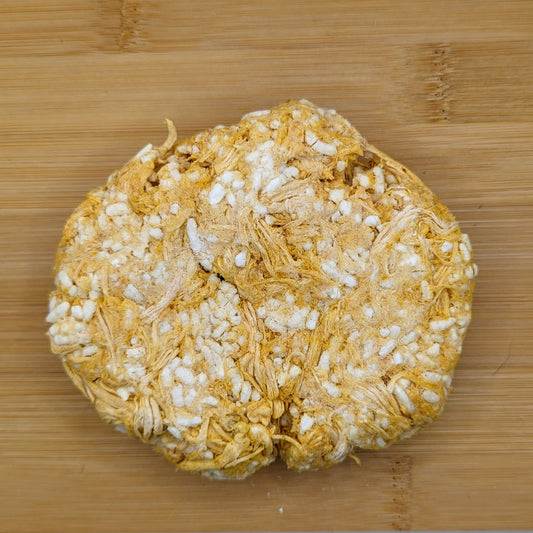 A portable snack: a whole grain rice cake on a wooden surface. becomes
A portable snack: a Beast Feast Freeze-Dried Chicken and Rice Recovery Meal Replacement on a wooden surface.