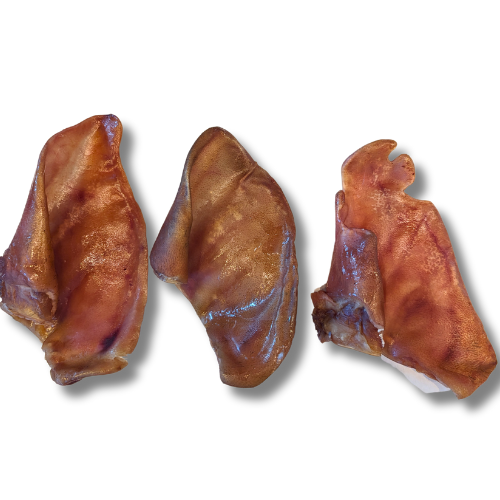 Three Beast Feast Heritage Breed Dehydrated Pig Ears on a white background.