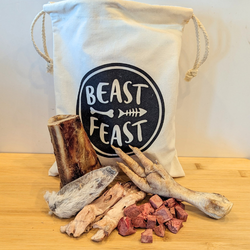 A Beast Feast custom curated sample bag with bones and the word beast feast.