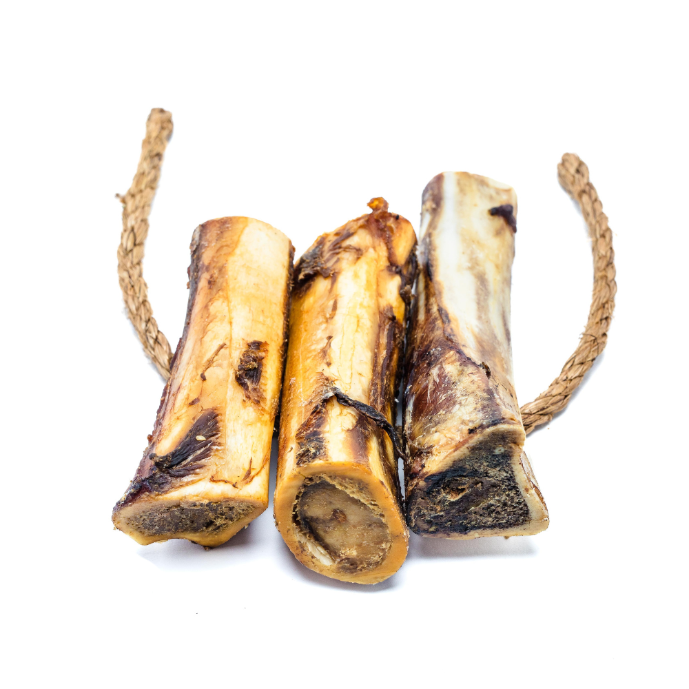 Three pieces of Beast Feast Smoked Bison Marrow Bones on a rope, offering a long-lasting chew experience.