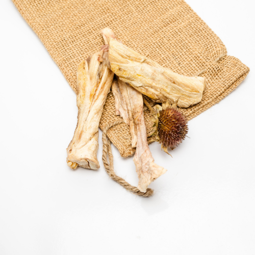 Beast Feast Freeze-Dried Bison Achilles Tendon in a burlap bag on a white background.